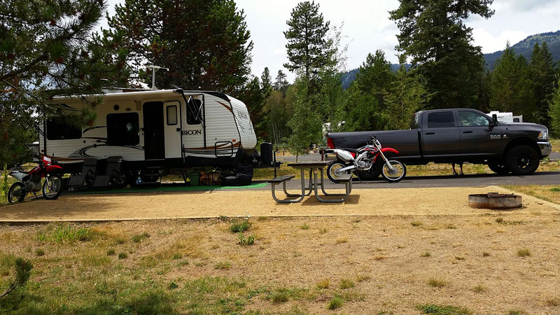 Doug & Lisa Kasefang show their 2014 camping setup, 26′ toy hauler, dirt bikes, 4-door Dodge Ram.