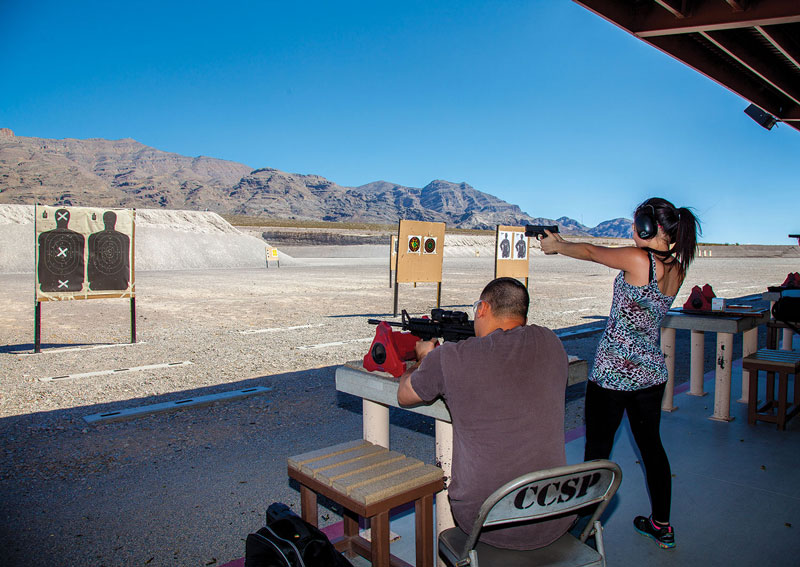 Clark County Shooting Complex rifle and pistol range, couple set up to shoot targets down range.