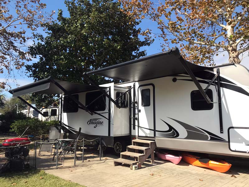Workamper trailer parked at RV site, Camp Gulf Campground in Florida