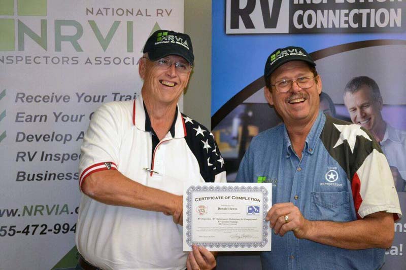 Don Hawes receiving certificate of completion for RV Inspector training