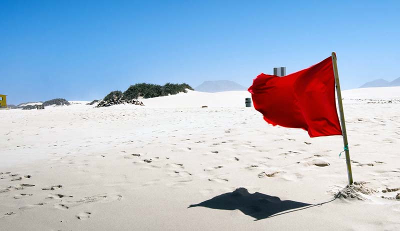 Red flag on a beach