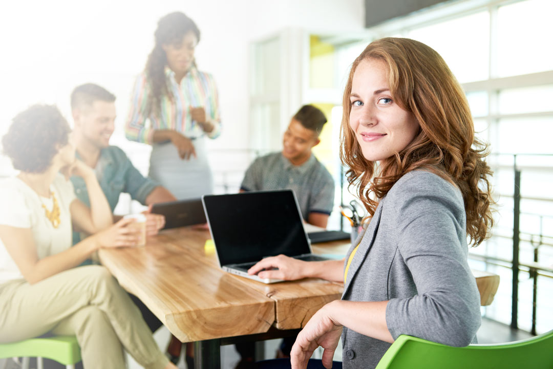 Woman With Laptop in Meeting