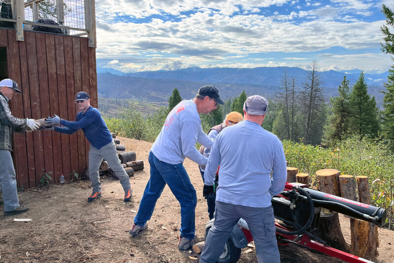 Idaho state parks volunteers splitting wood