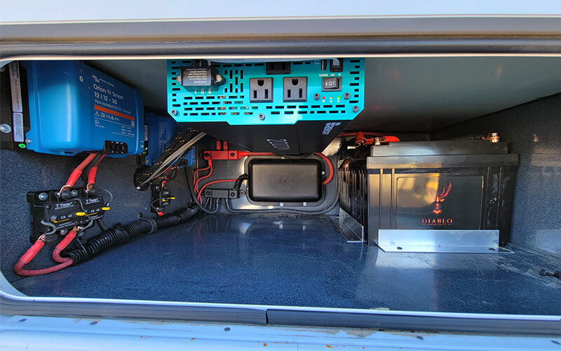 an rv solar control system neatly installed in a compartment