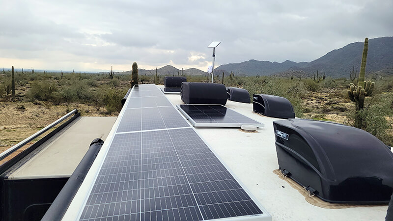eight panel solar array installed atop a motorhome