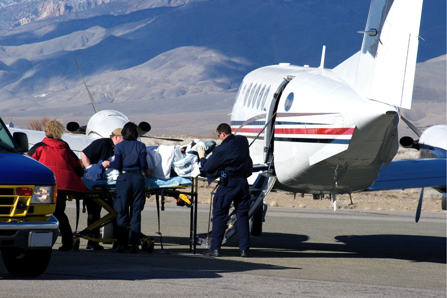 airplane ambulance medevac loading patient on stretcher