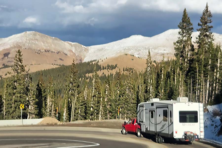 Jessica Peacock - truck towing fifth-wheel RV through Colorado mountains