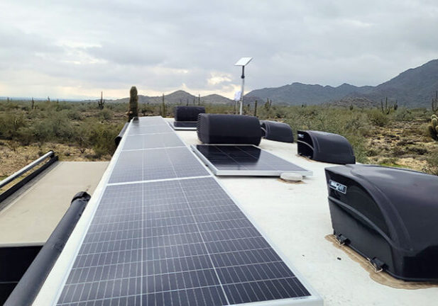 eight panel solar array installed atop a motorhome