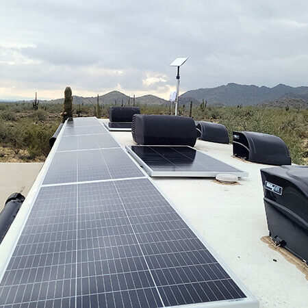 eight panel solar array installed atop a motorhome