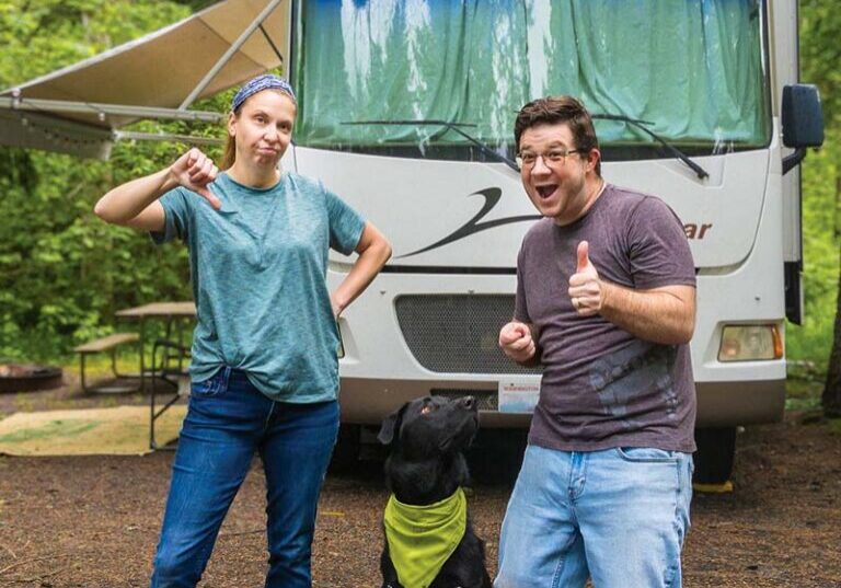 Workamping couple Levi and Natalie Henley showing thumbs up and thumbs down gestures with their dog by an RV, highlighting positive and negative attitudes for Workampers.