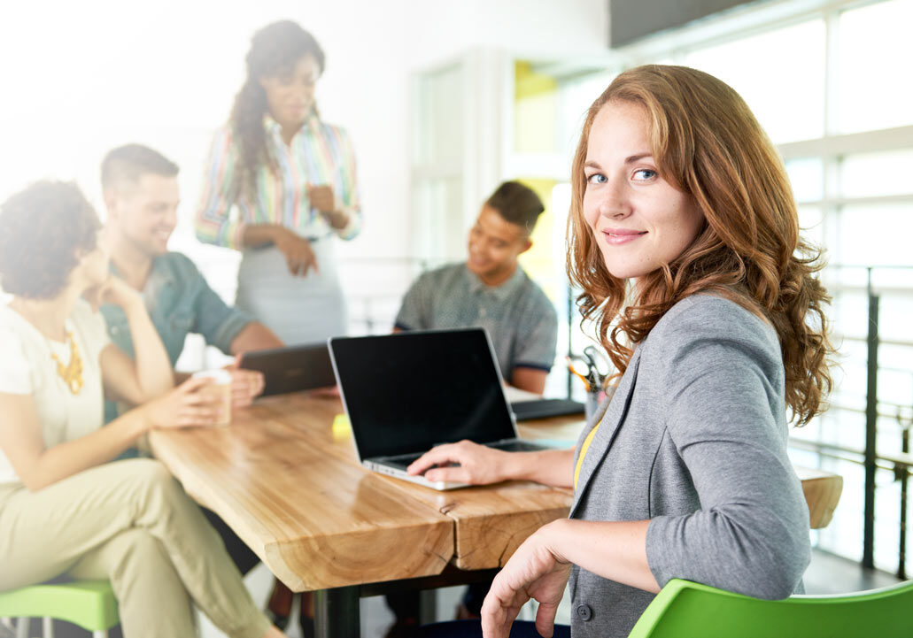 Woman With Laptop in Meeting