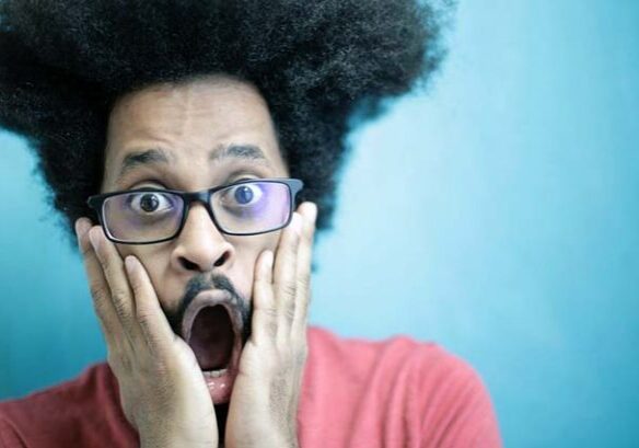 Surprised man reacting with astonishment.