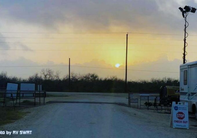 Campground gate guard booth at sunset, showing the view from the booth where Workampers manage entry.