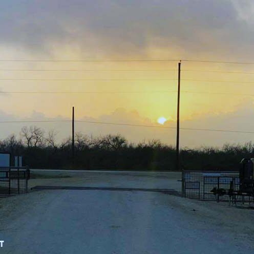 Campground gate guard booth at sunset, showing the view from the booth where Workampers manage entry.