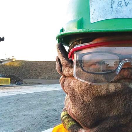 Sugar beet Workamper wearing protective gear for harvest.