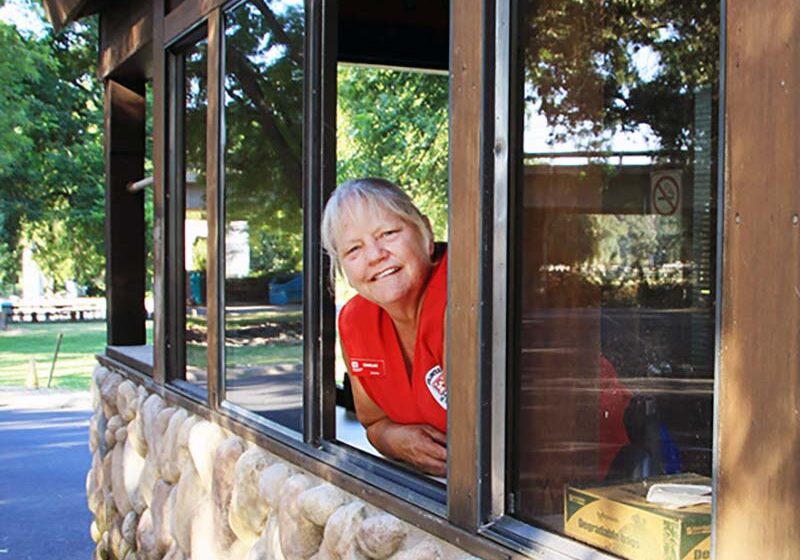 Workamper Donna Lindsey greets visitors as they enter the Orange Blossom Rec Area of the Stanislaus Project in California