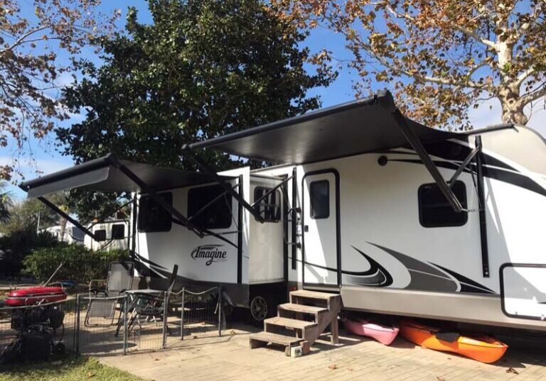 Workamper trailer parked at RV site, Camp Gulf Campground in Florida