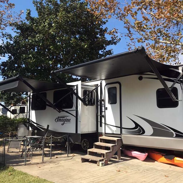 Workamper trailer parked at RV site, Camp Gulf Campground in Florida