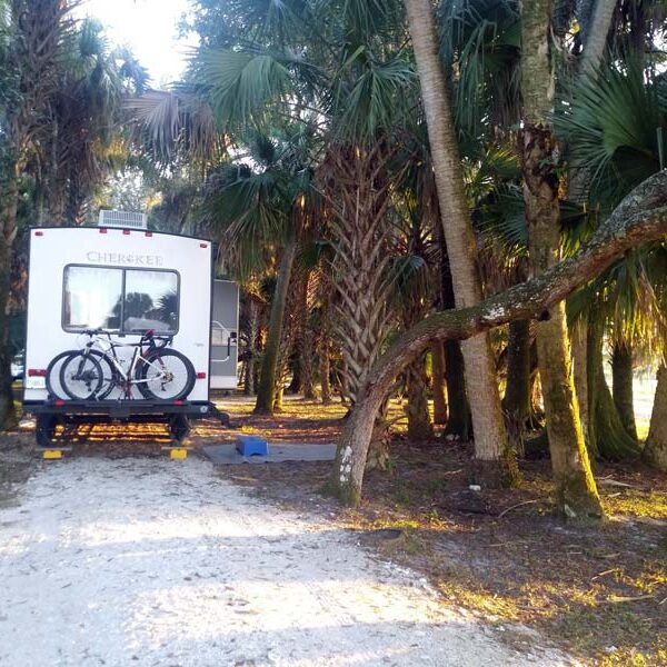 Cherokee RV parked at City Lickers Inc. in Fort Pierce, Florida, Workampers Amber & Dylan DeGan