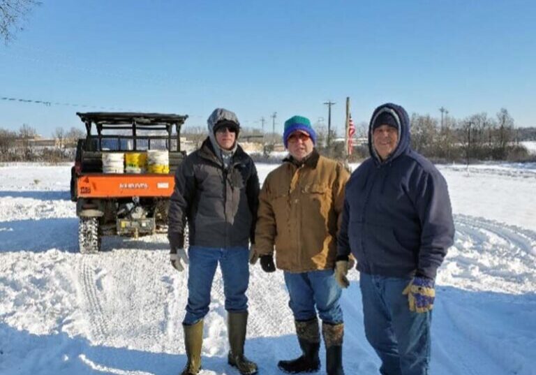 Workamper volunteers stepped up during Texas’ historic 2021 winter storm, three men working in the snow at Northeast Texas Community College.
