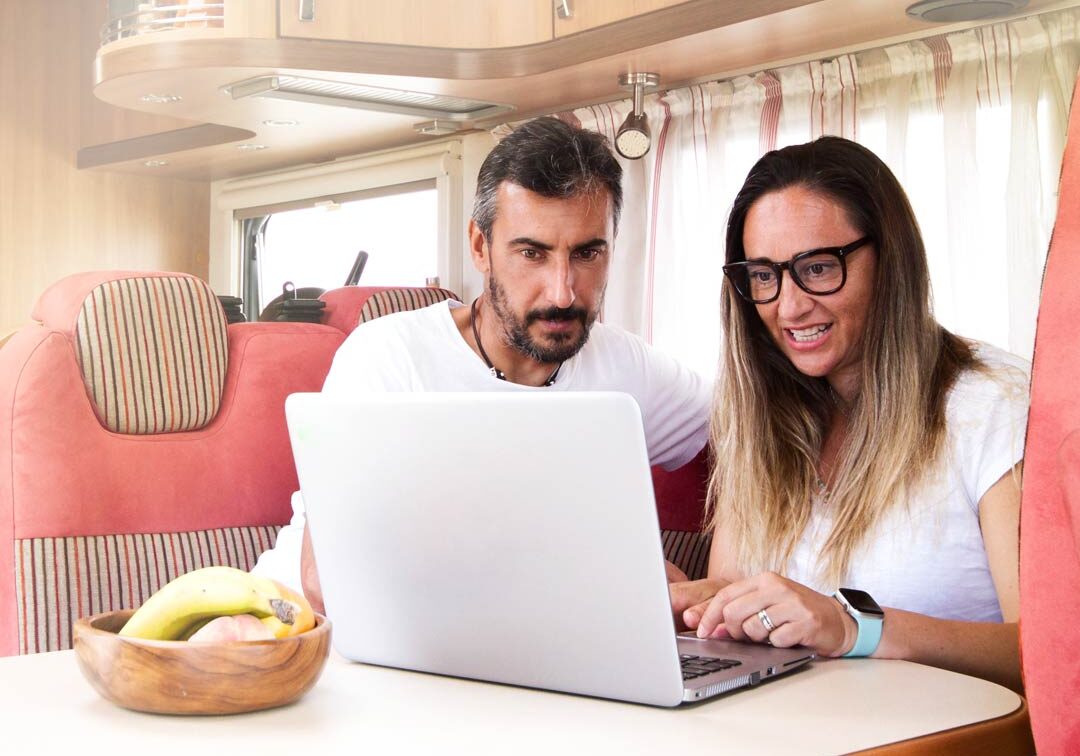 Couple Working On Laptop